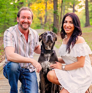 Dr. Dickson with his wife and dog