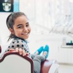 young girl in dentist chair at family dentist