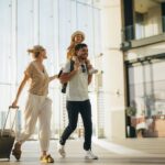 family traveling in airport needing to keep up their dental health while on vacation